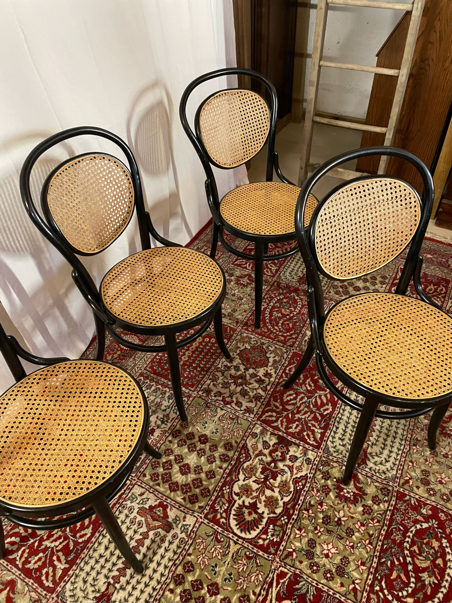 Set of 4 bentwood bistro chairs in black with caning.