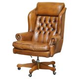 Captain's chair Chesterfield vintage leather with tufted wingback.