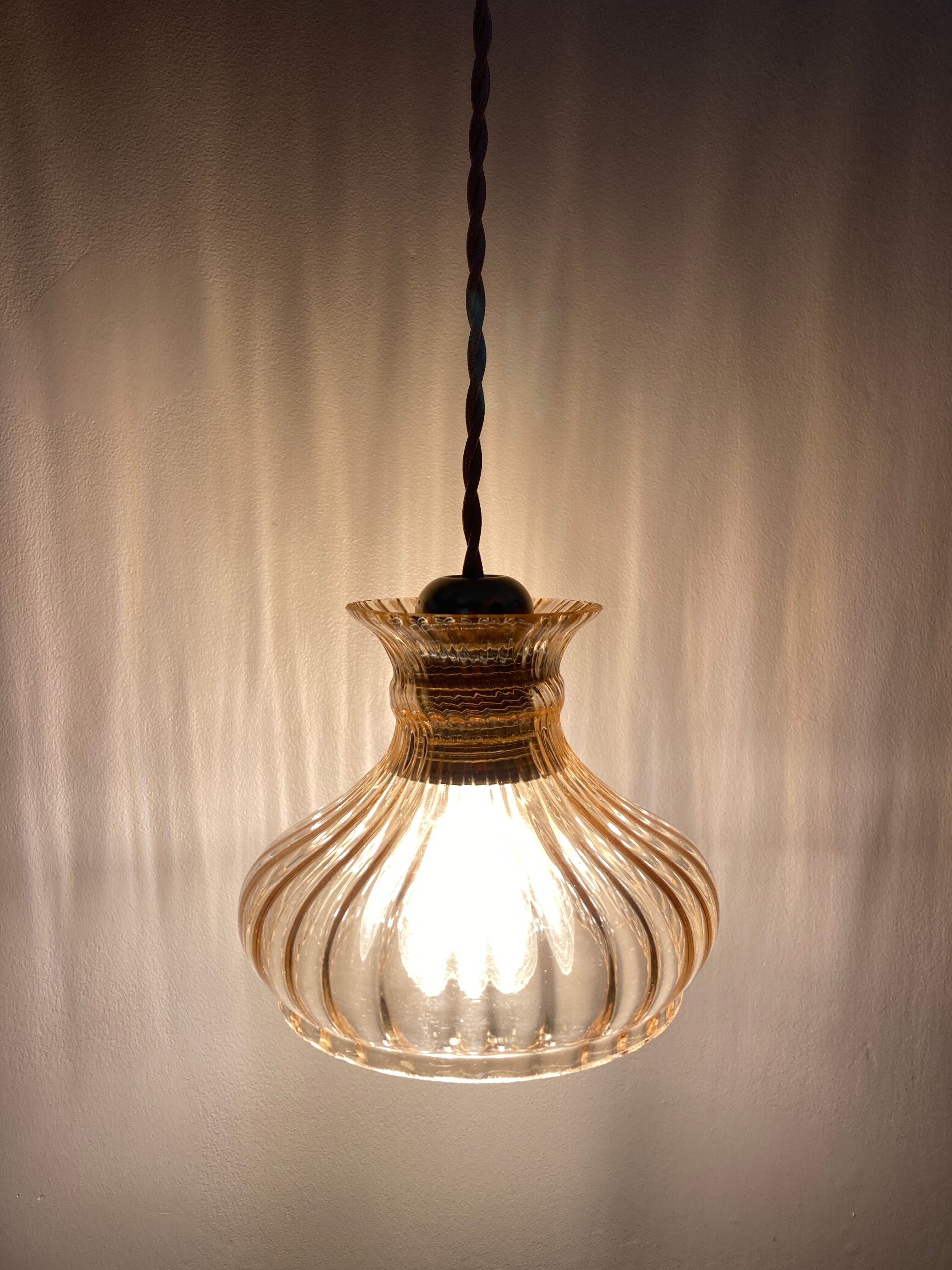 Pair of amber glass walkmen to hang in suspension