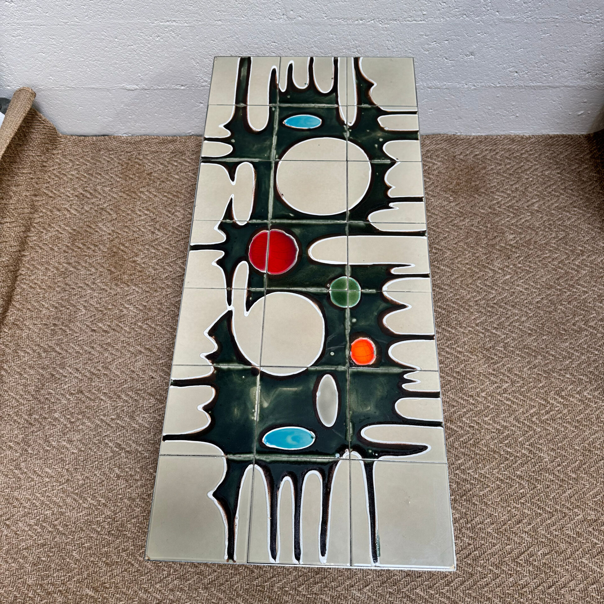 Vintage coffee table from the 60s and 70s in ceramic, chrome metal, and wood.