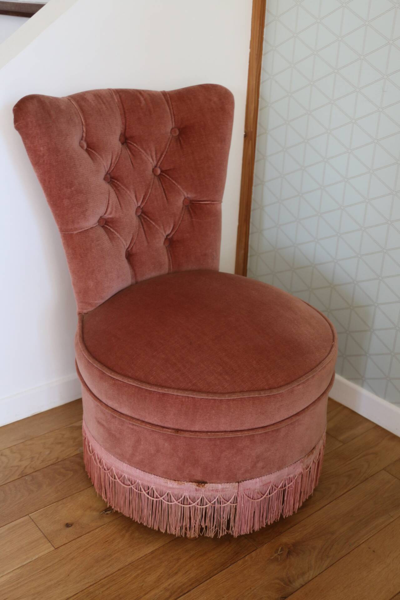 Powder pink fireside chair with fringes