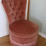 Powder pink fireside chair with fringes