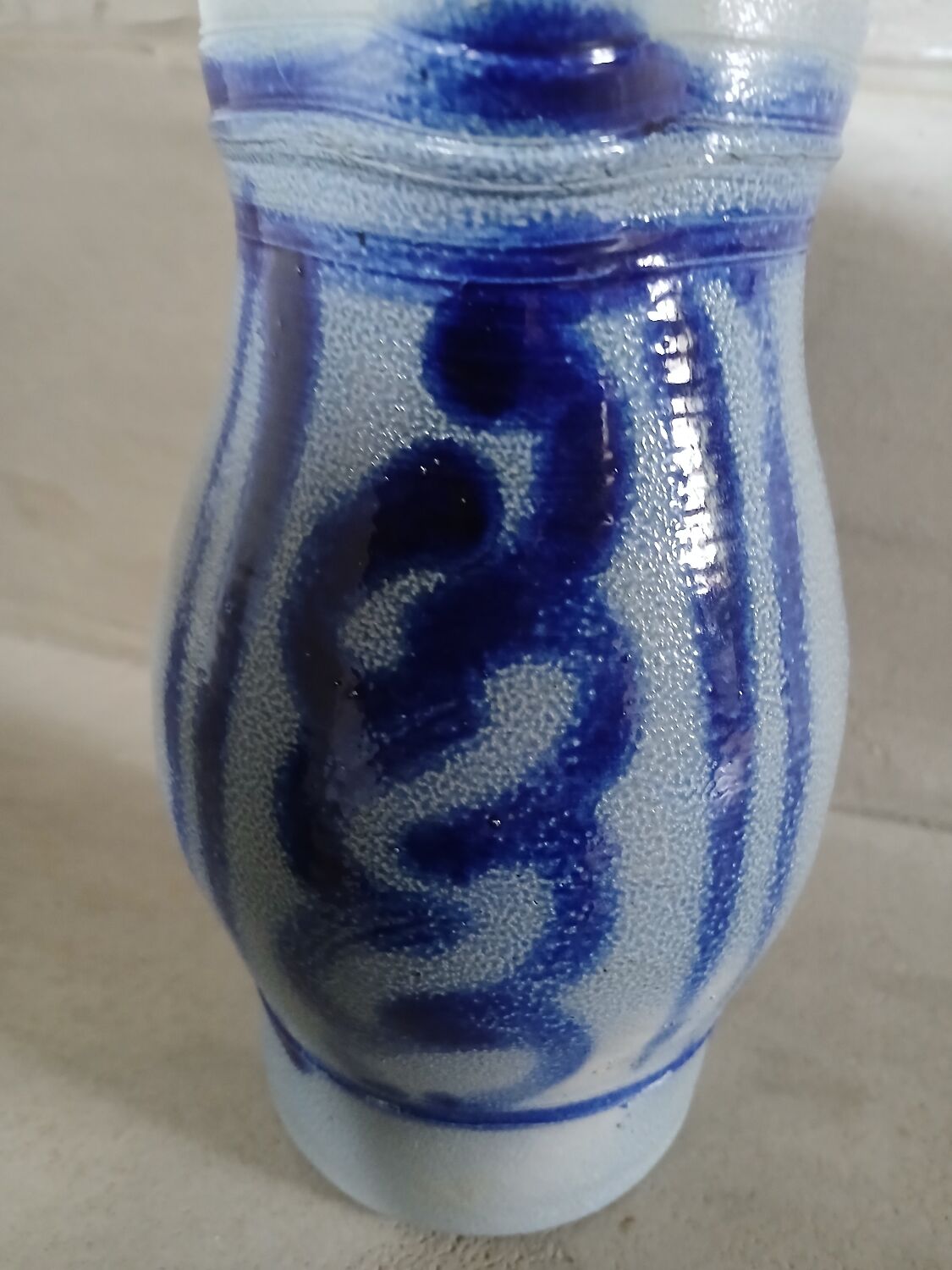 2 antique stoneware pitchers