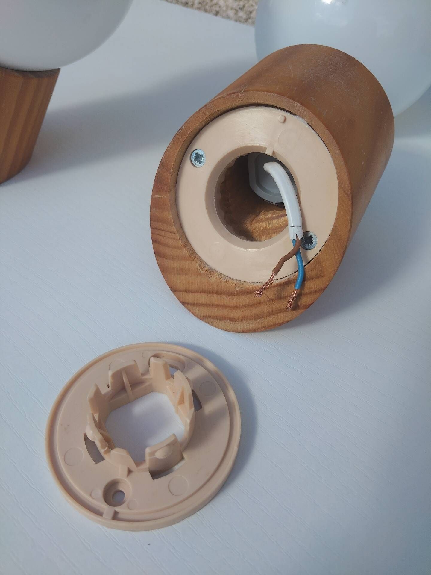 Pair of vintage wall lights in varnished pine and opal glass, 1970s-80s.