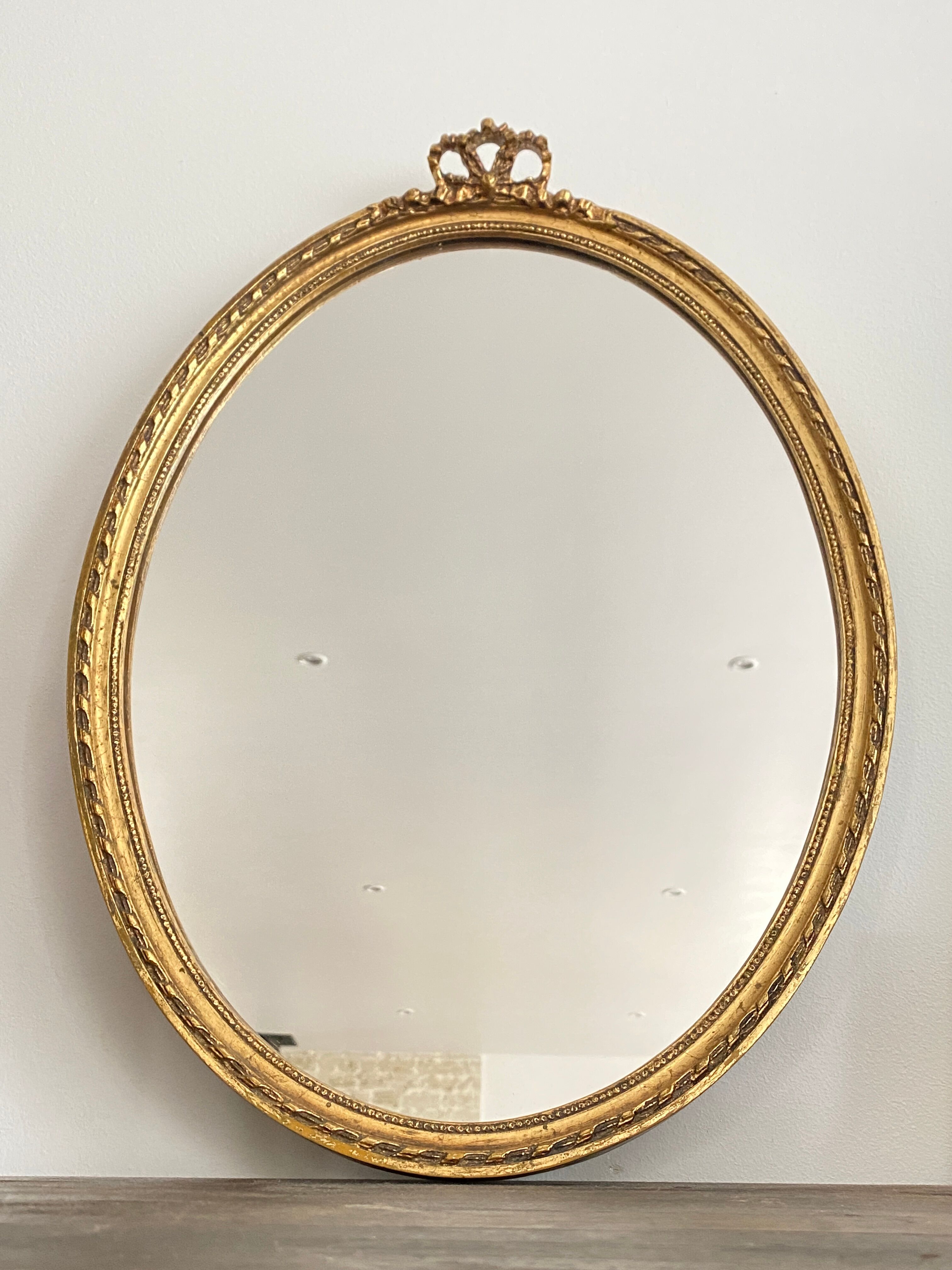 Golden oval mirror 32x44cm