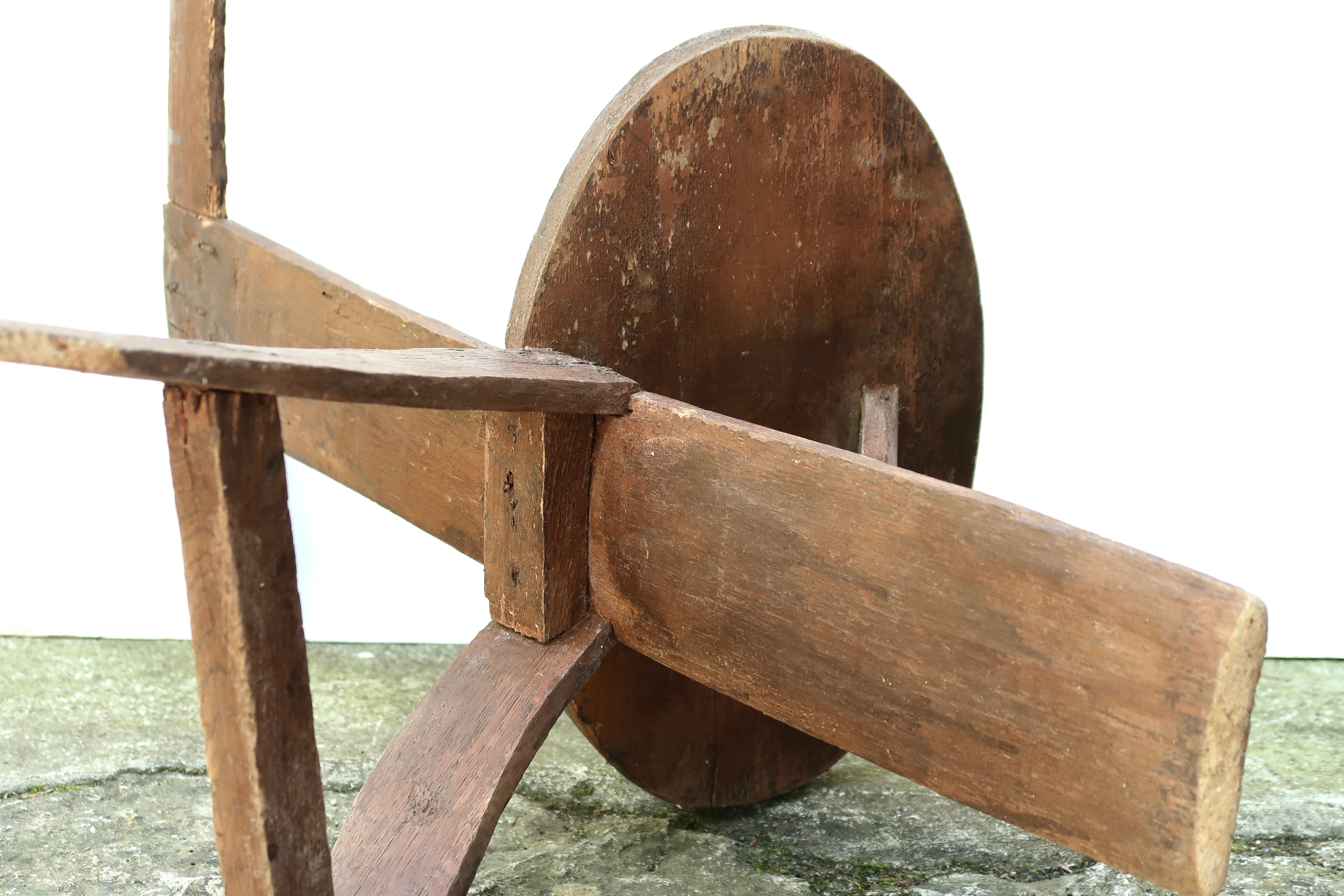 Regionalist wooden tripod chair