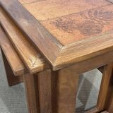 Set of 3 nesting tables in teak with tiled tops.