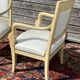 Paire de fauteuils aux dauphins d’époque empire en bois laqué