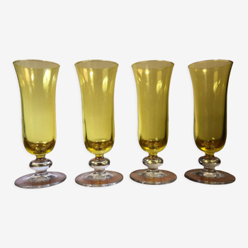 Large transparent yellow champagne flutes