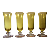 Large transparent yellow champagne flutes