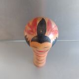 Kokeshi with swivel head