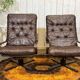 Pair of Norwegian swivel armchairs in leather and beech from the 1970s.