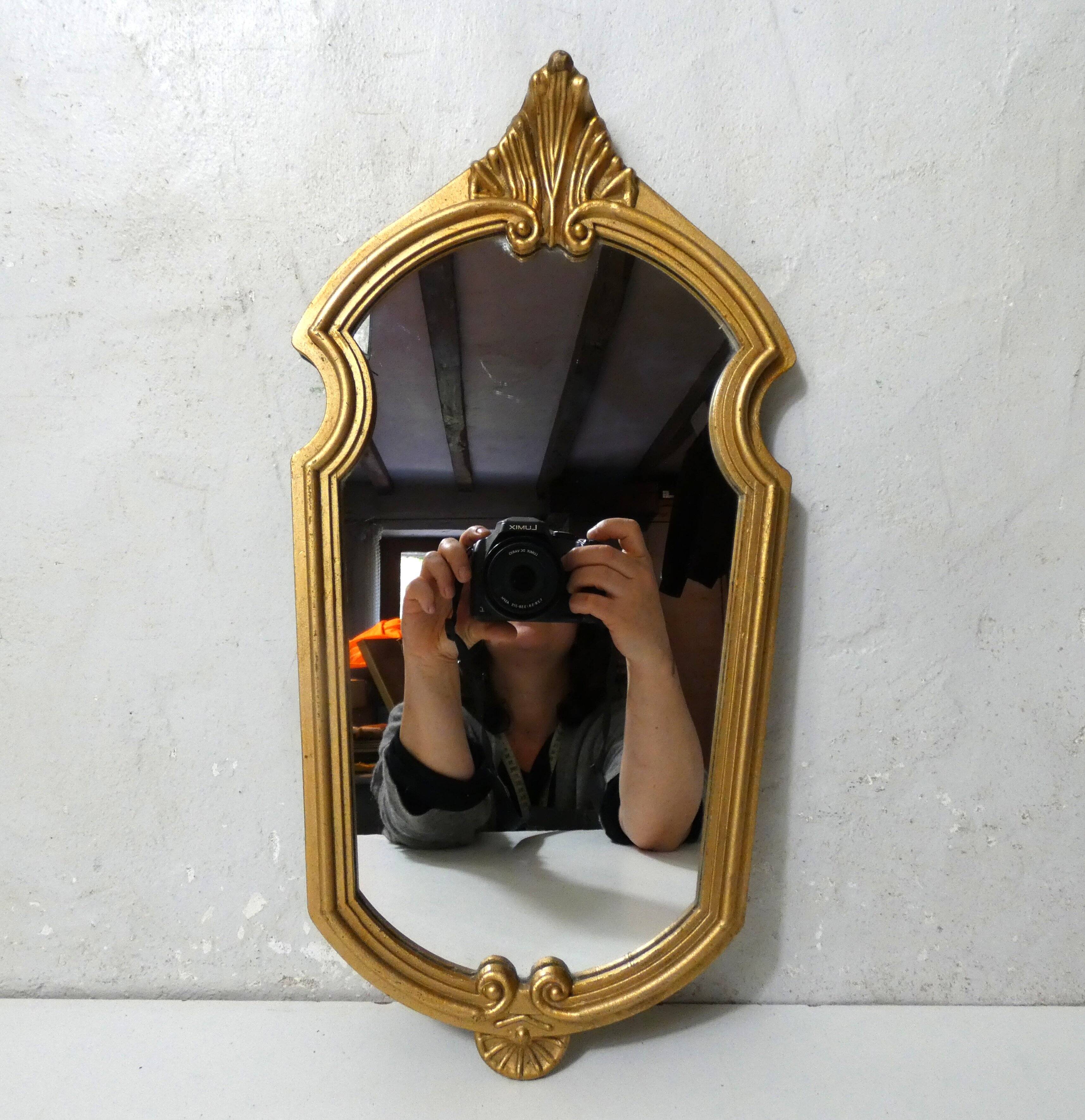 Antique Louis XV style mirror with a vintage carved gold frame.