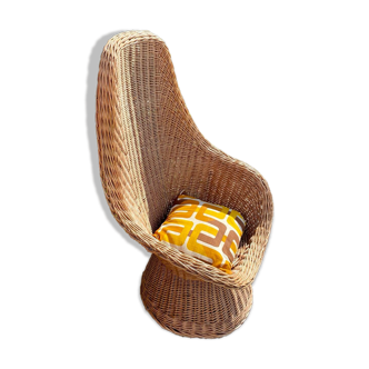 Rattan armchair and its cushion, 1960