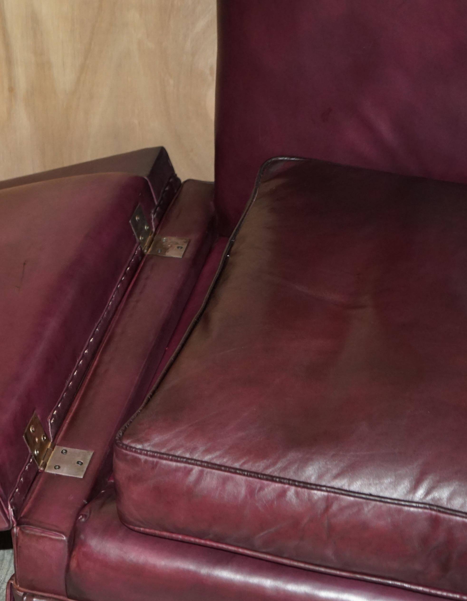 Victorian Knole canapé restored in leather with feather cushions.