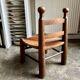Low brutalist chair in dark wood and straw no. 2