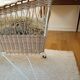 Rattan and wrought iron cradle