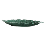 Green earthenware dish in the shape of a leaf