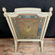 Front of Louis XVI fireplace in laqué wood and fabric has floral decorations