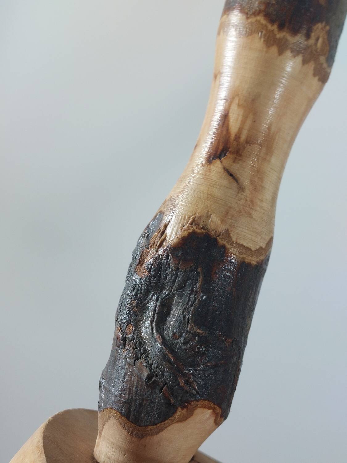 Pair of walnut stools sculpted in a vintage mid-century cross-section.