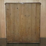 Antique Victorian pine governess buffet with sliding shelf.