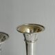 2 large patinated metal soliflores