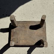 Small stool, rectangular solid teak side table with curved legs.