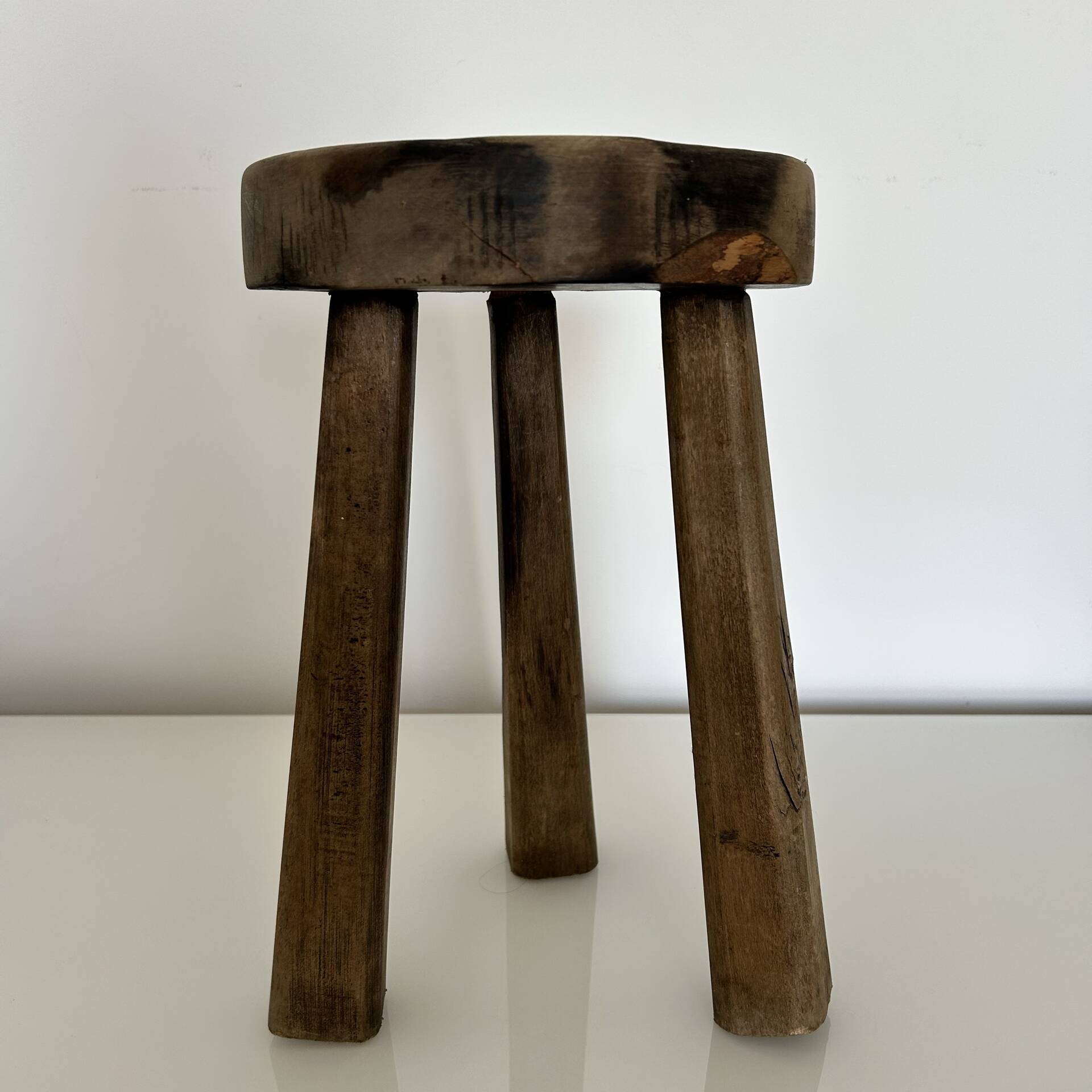 Patinated tripod stool