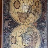 Wood and brass coffee table with a world map under glass.