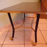 Lounge table, side table on wheels, formica top, gold and black metal
