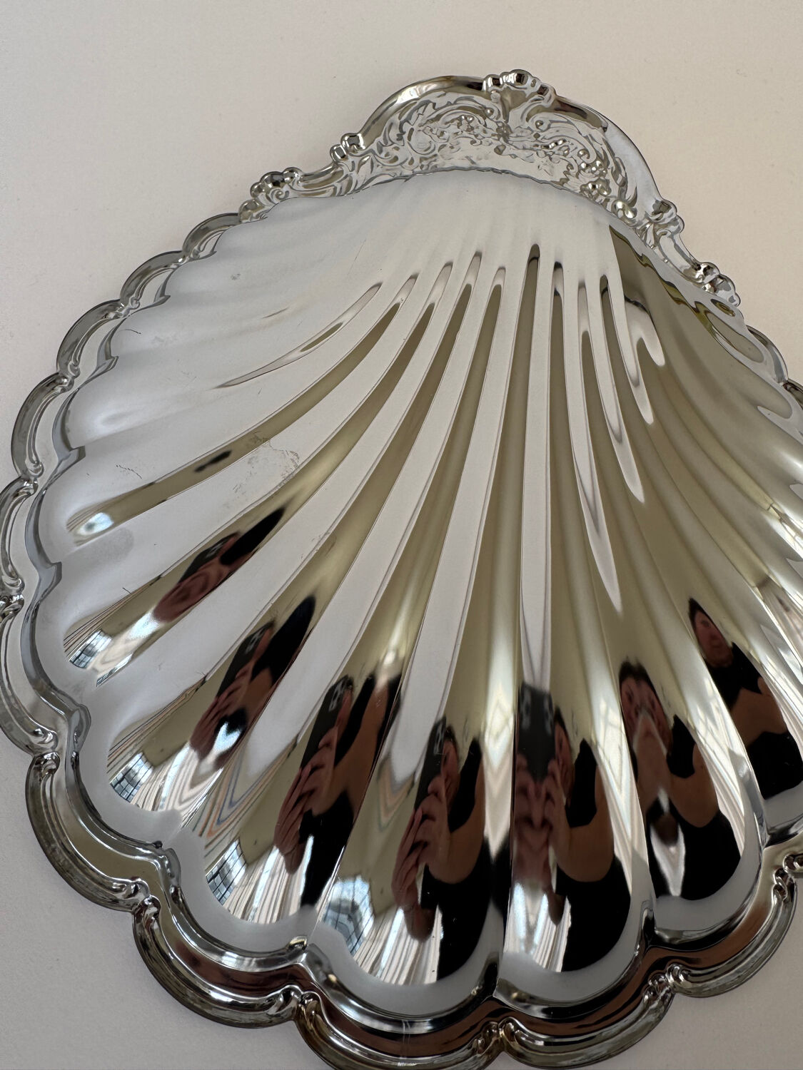 Large silver-plated serving dish in the shape of a vintage shell.