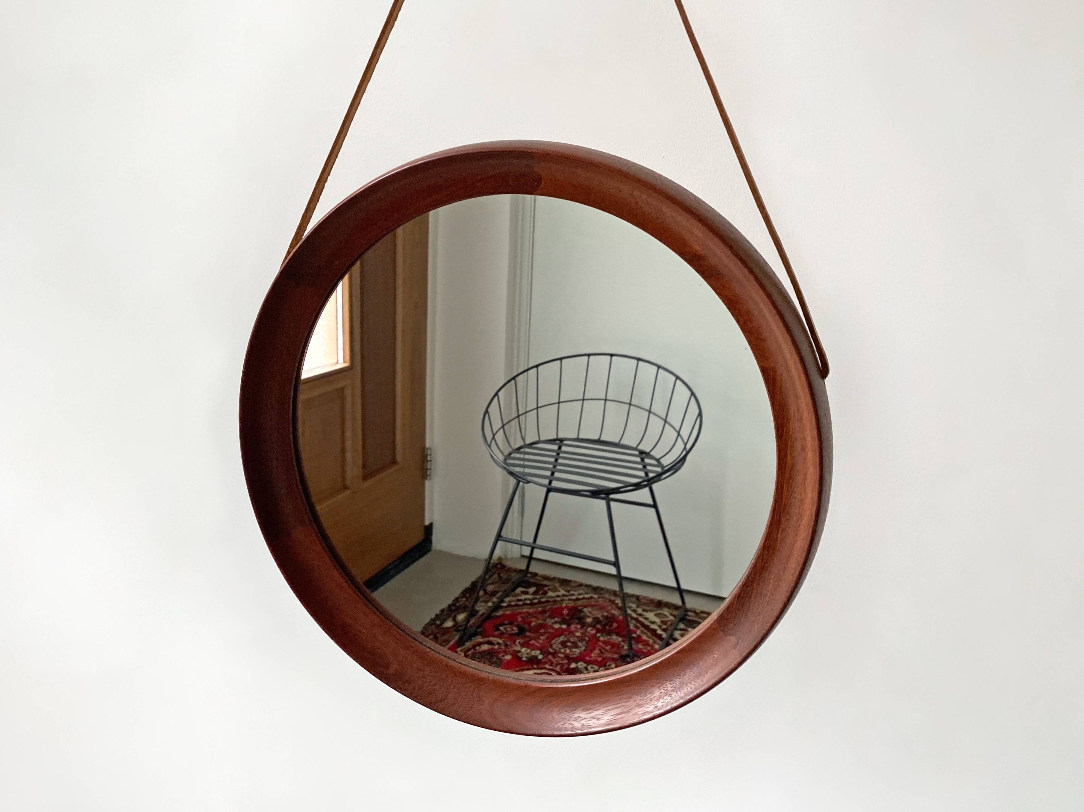 Mid Century solid teak wall mirror with a leather strap - Danish design