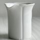 White porcelain milk jug, elegant design.
