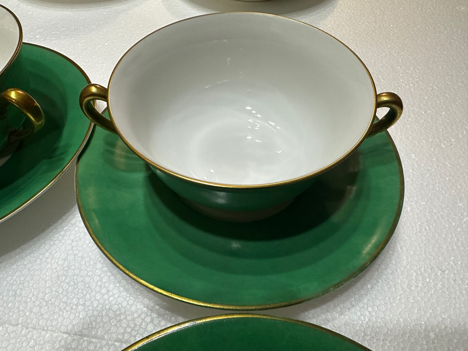 Service 14 cup and saucer in Art Deco Emerald Green and Gold.