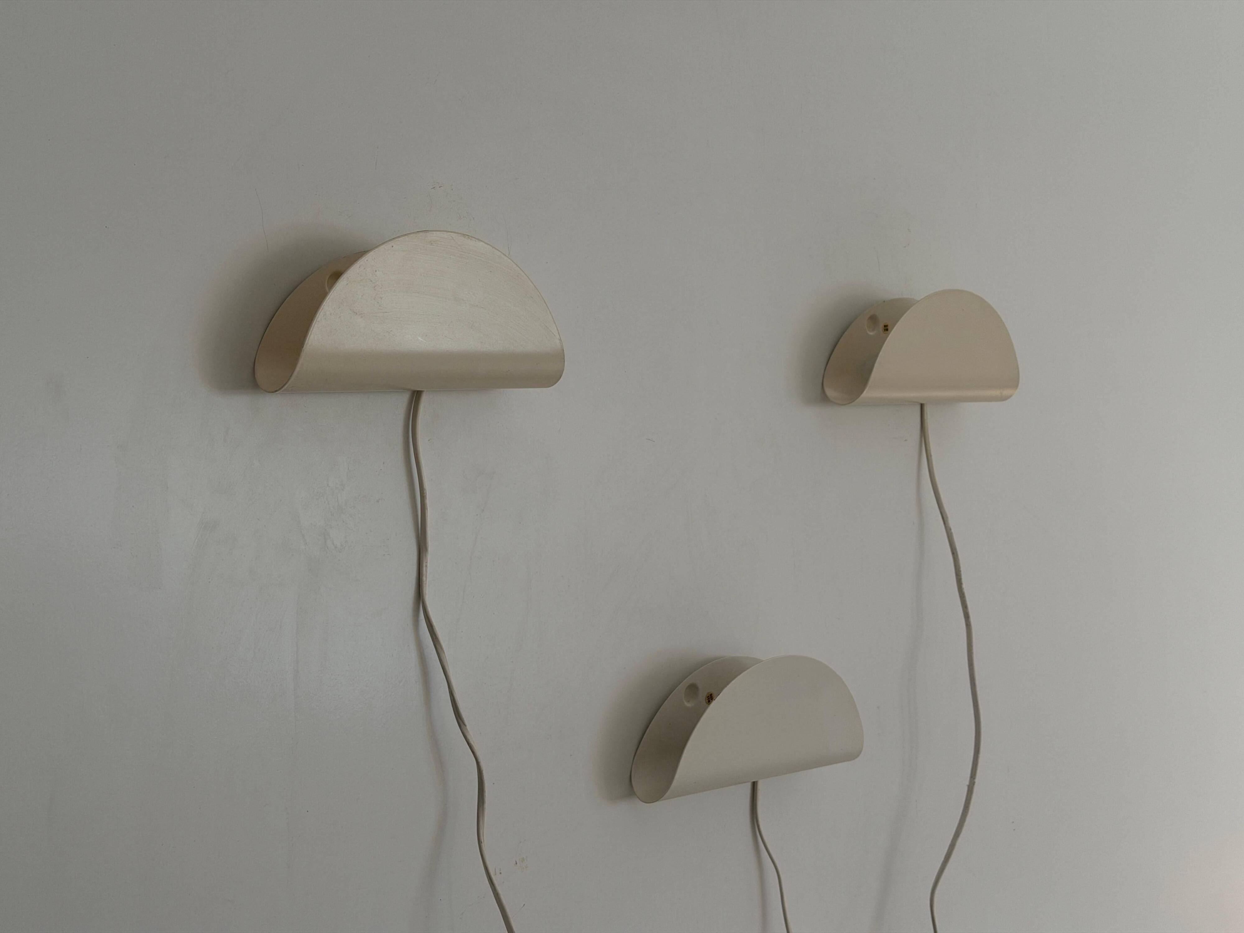 Set of three cream metal wall lights by Nordlux, 1980s, Sweden.