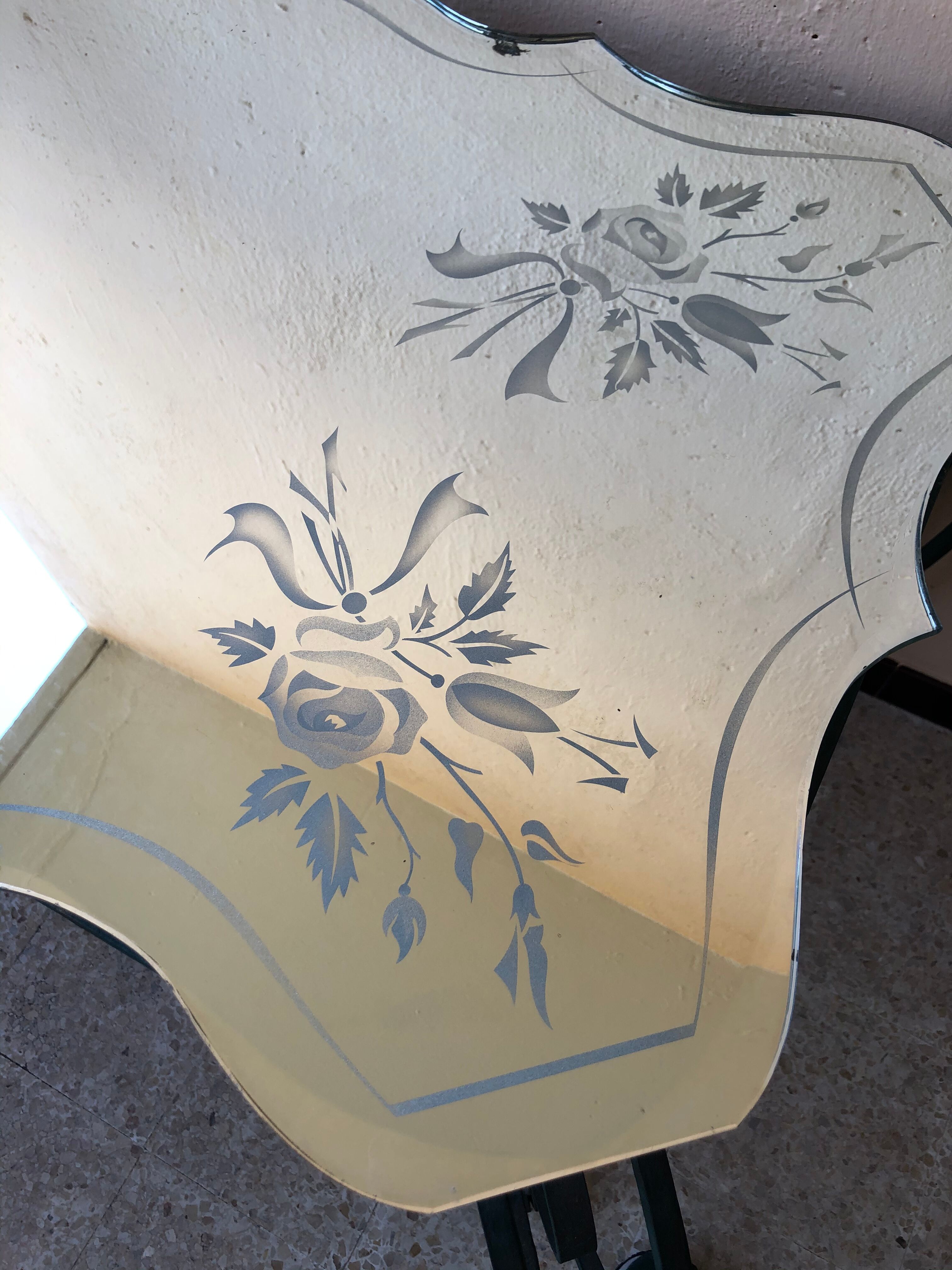 Wrought iron and engraved mirror