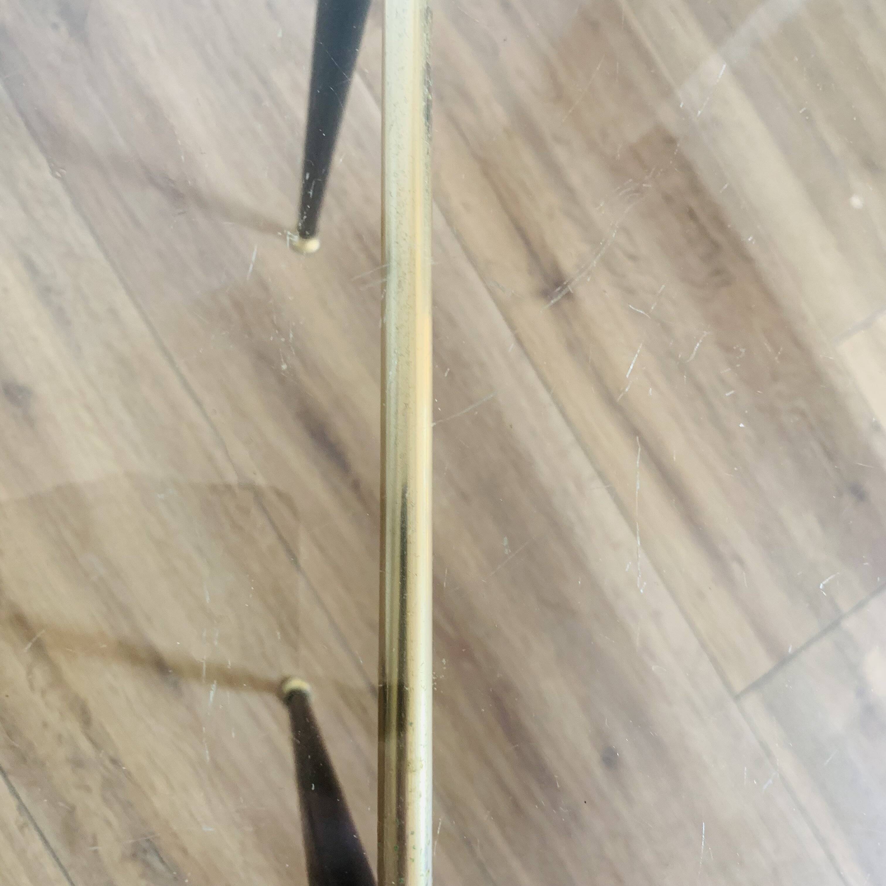 Coffee table from the 50s/60s, glass, brass, black metal.