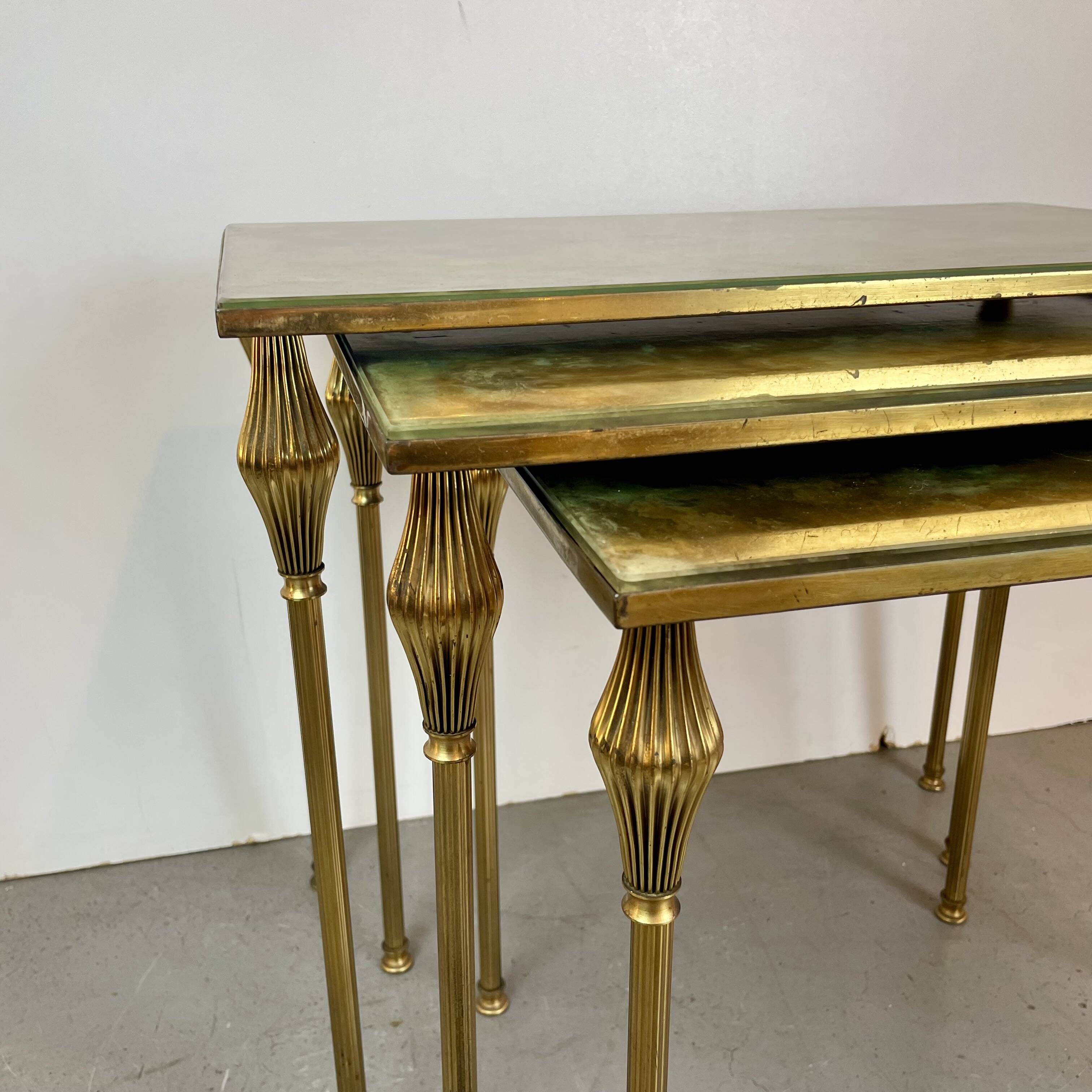 Nested brass tables, attributed to Maison Baguès, France, 1950–60.