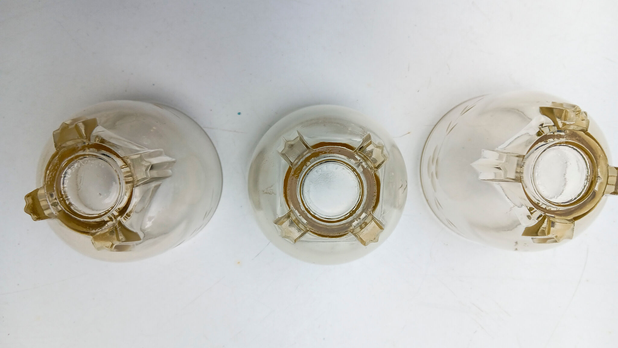 3 low glasses on Art Deco stand