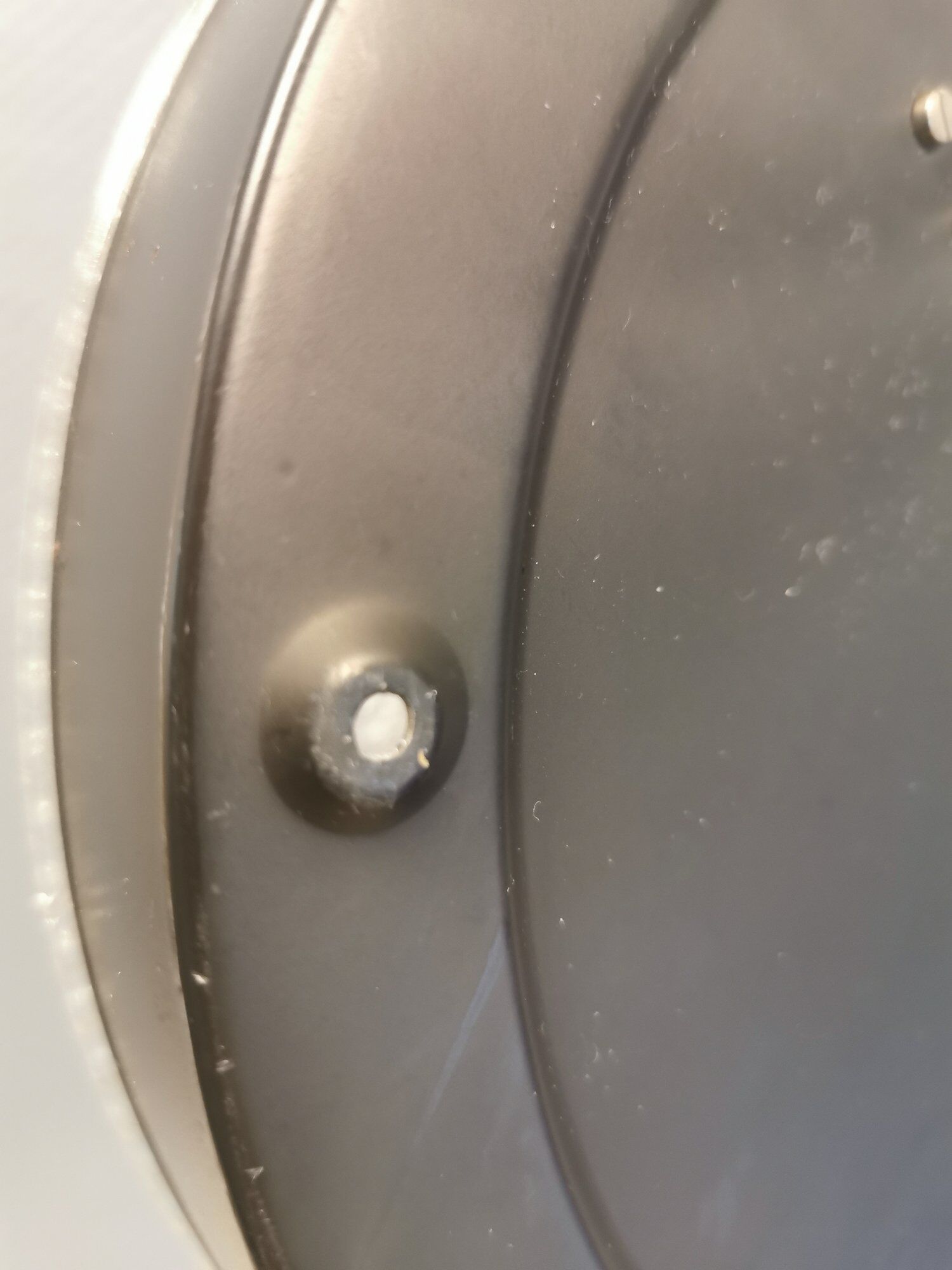 Ceiling light, in dark metallic paint with thick glass shade with beautiful details in the glass.