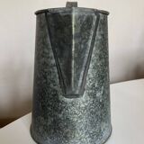 Old garden pitcher vase in folded zinc