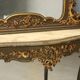 Ancient baroque console with a wooden mirror, Italy, late 19th century.