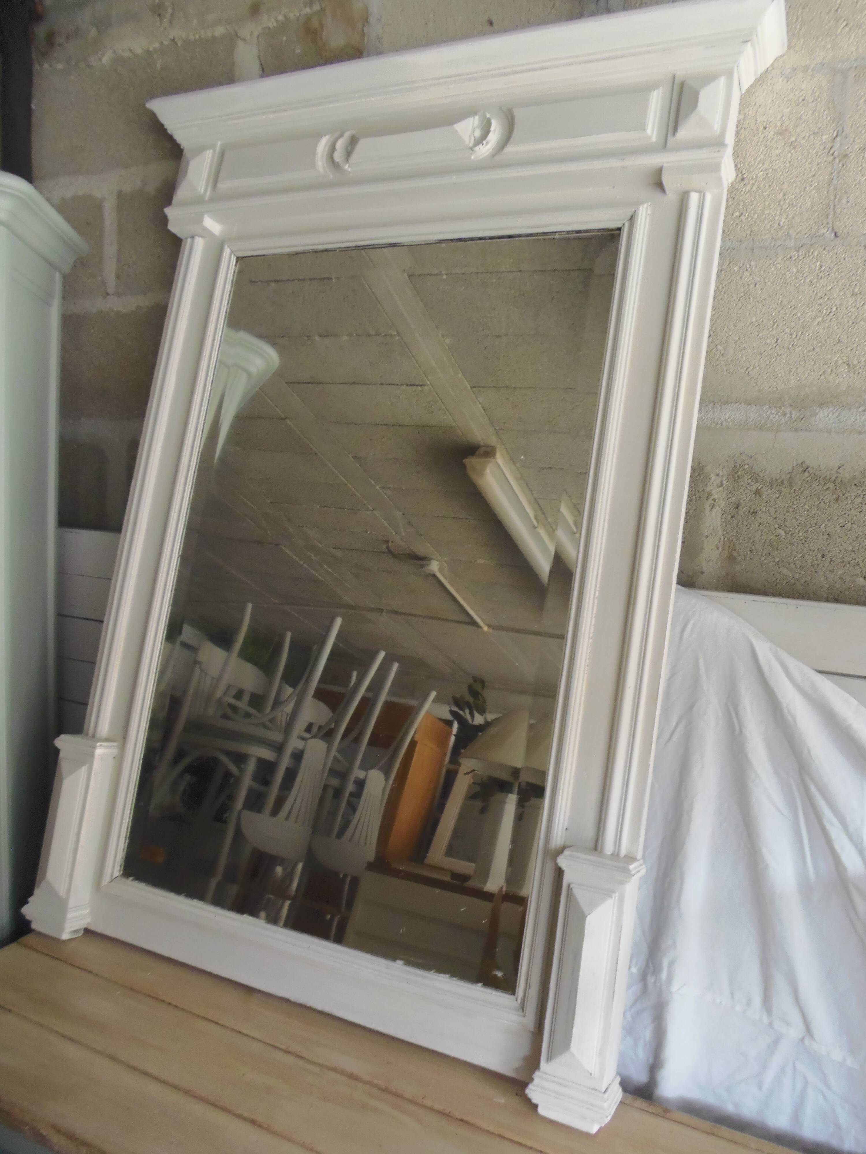 Antique bevelled mirror, frame in pearl grey patinated wood.