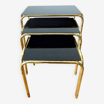 Vintage 1970 gold metal nesting tables.