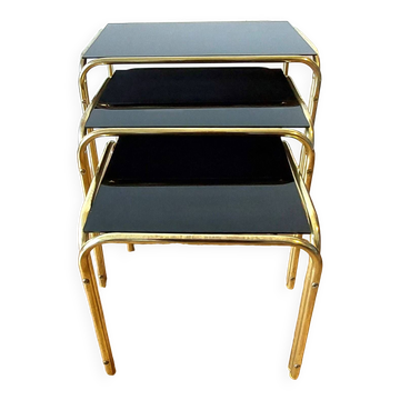Vintage 1970 gold metal nesting tables.
