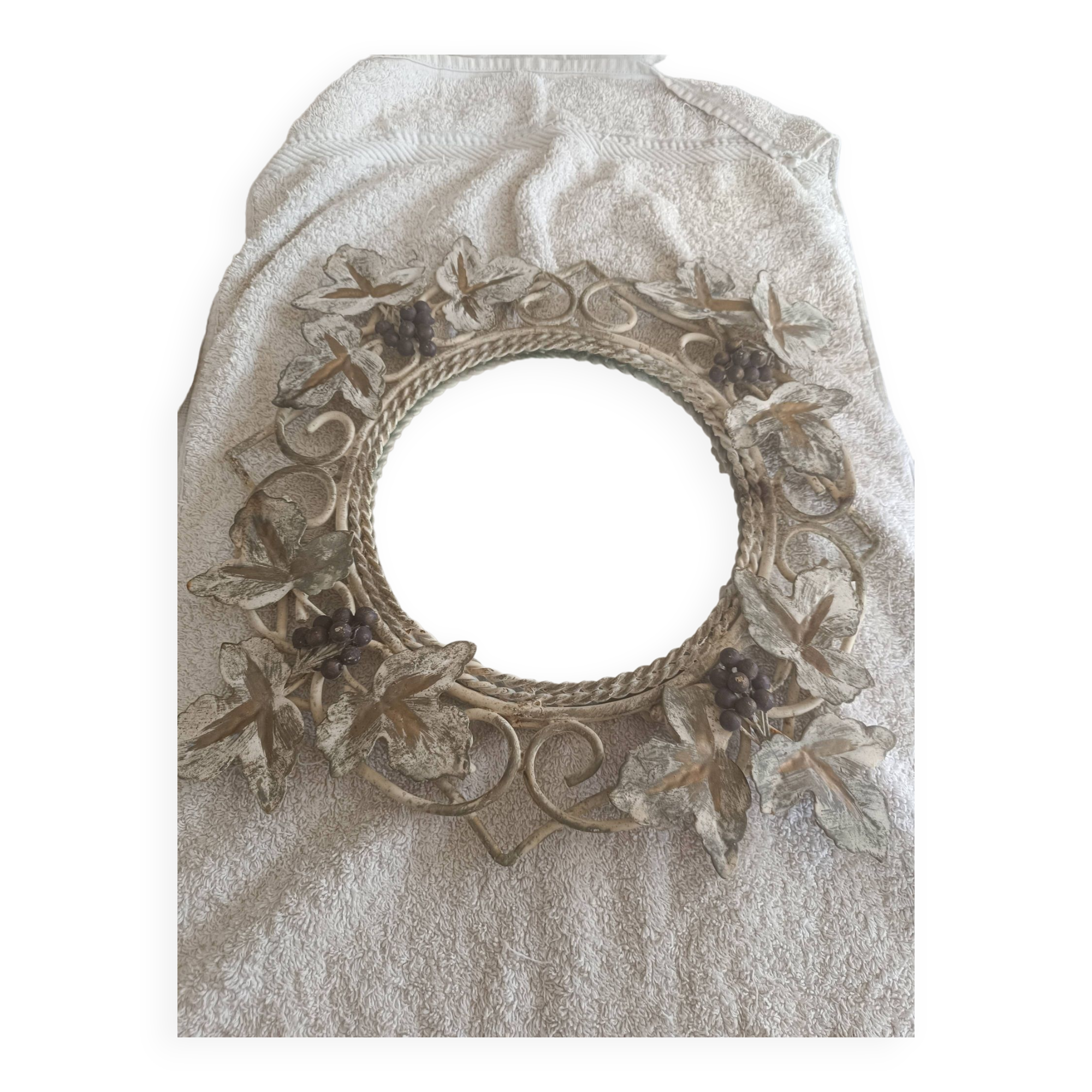 Wrought iron mirror. Grape leaf decoration.