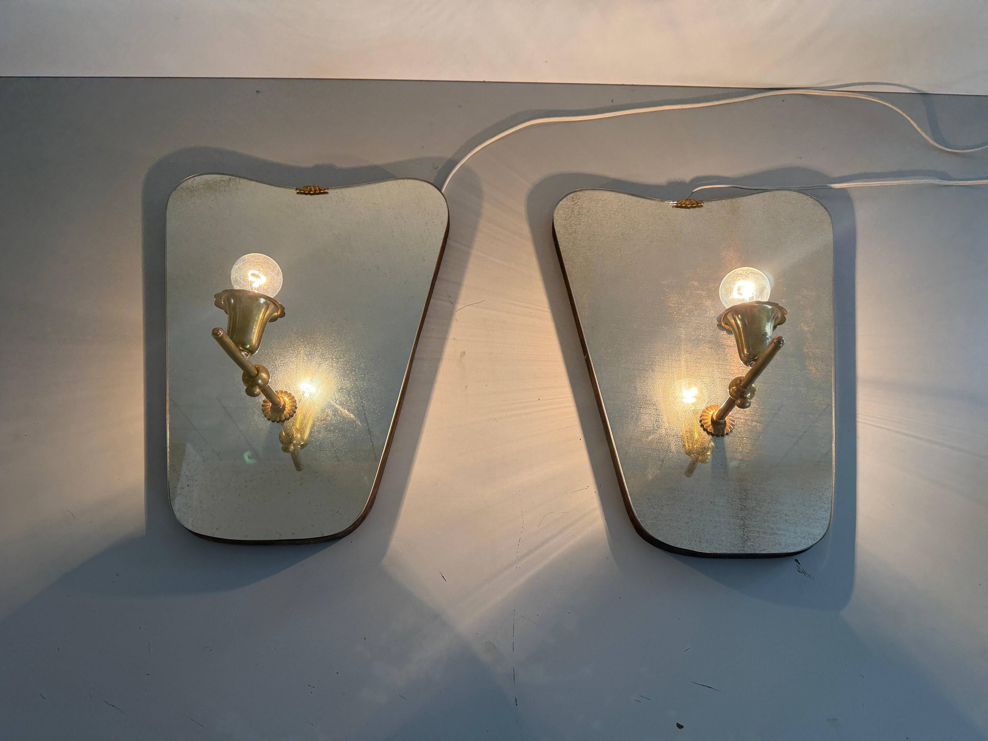 Pair of brass wall lights with mirrors, mid-20th century, Italy, 1960.