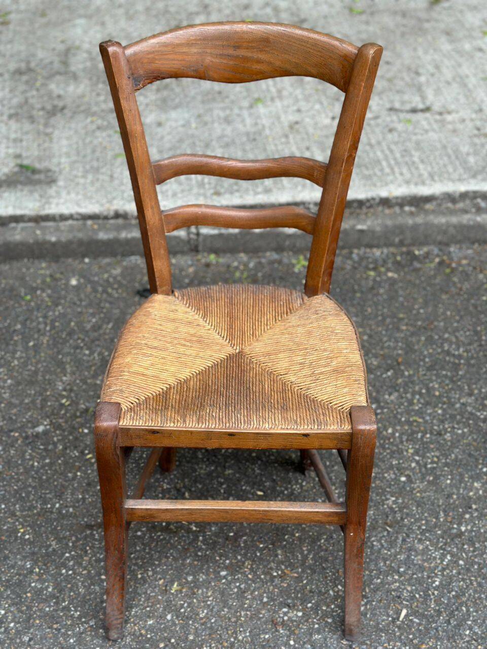 Period rustic chair with a straw seat