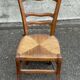 Period rustic chair with a straw seat