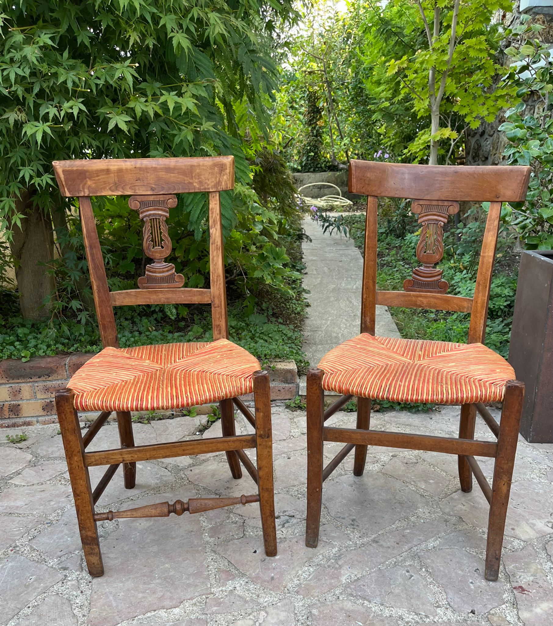 Pair of straw seated chairs